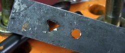 How to make a triangular hole in thick steel