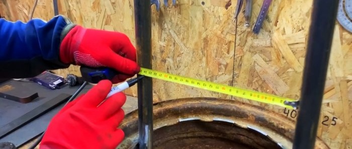 Stand for splitting firewood with a hammer from an old car wheel