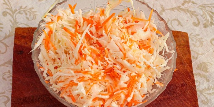 Combine chopped cabbage and carrots