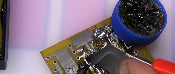 Scrape off the soldering iron tip