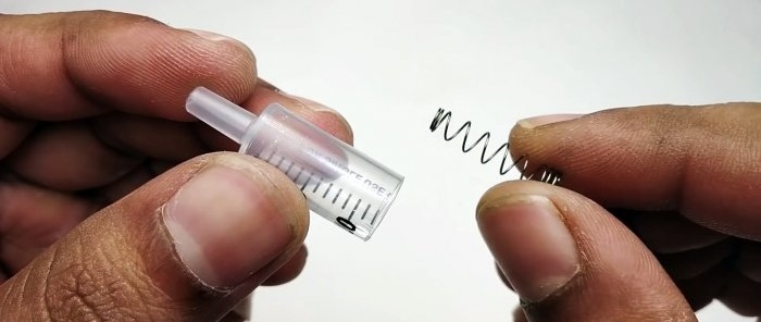 How to make a miniature compressor from a syringe and a machine gearbox