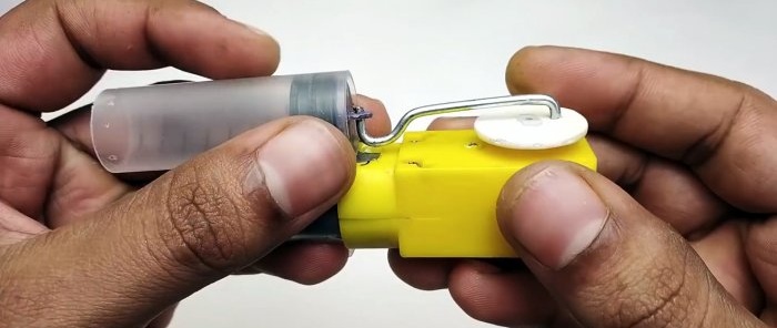 How to make a miniature compressor from a syringe and a machine gearbox