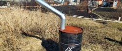 Economical long-burning stove for a greenhouse made from a barrel