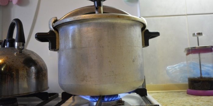 Homemade canning of pink salmon in a pressure cooker