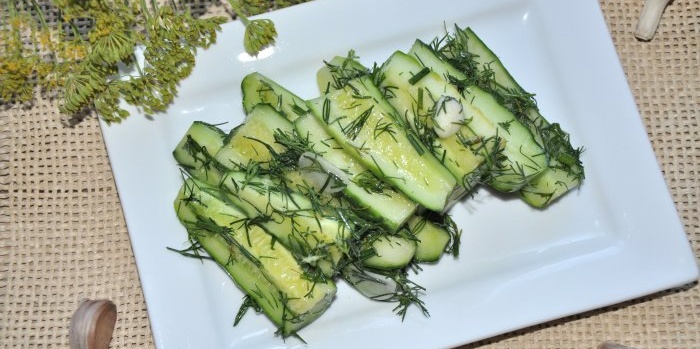 Instant lightly salted cucumbers in a saucepan