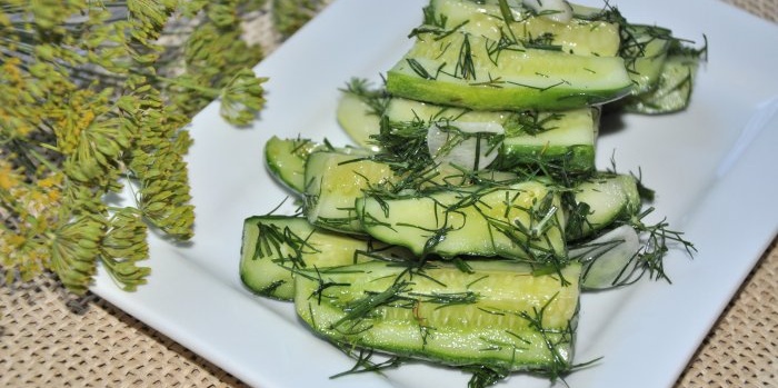 Instant lightly salted cucumbers in a saucepan