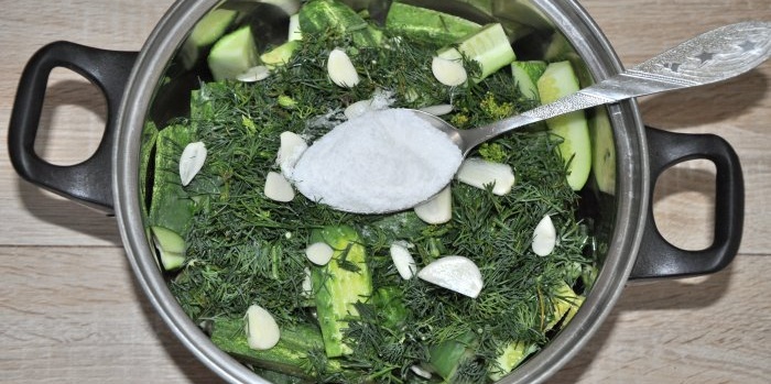 Instant lightly salted cucumbers in a saucepan