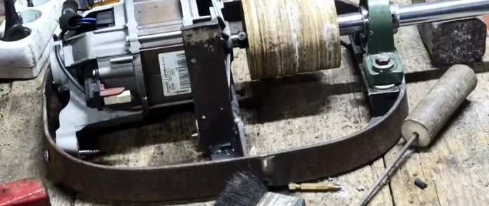 Two in one: how to make a belt grinder and polishing machine from a washing machine motor and an old shock absorber